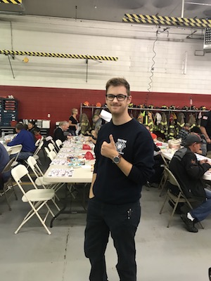 A Firefighter/EMT cadet helps out at the 2018 Pancake breakfast at the fire station.