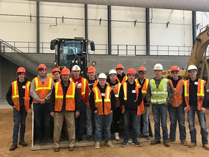 School board member, Don Vruwink, and MHS students pose for a photo at the Operating Engineers training facility in Coloma, WI.
