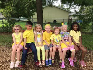 children sitting on bench children sitting on bench