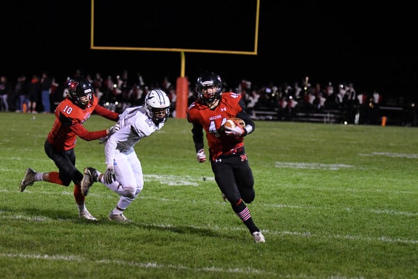boys football player running defender defending boys football player running defender defending