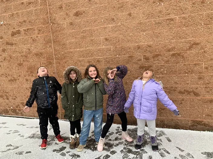 kids catching snow
